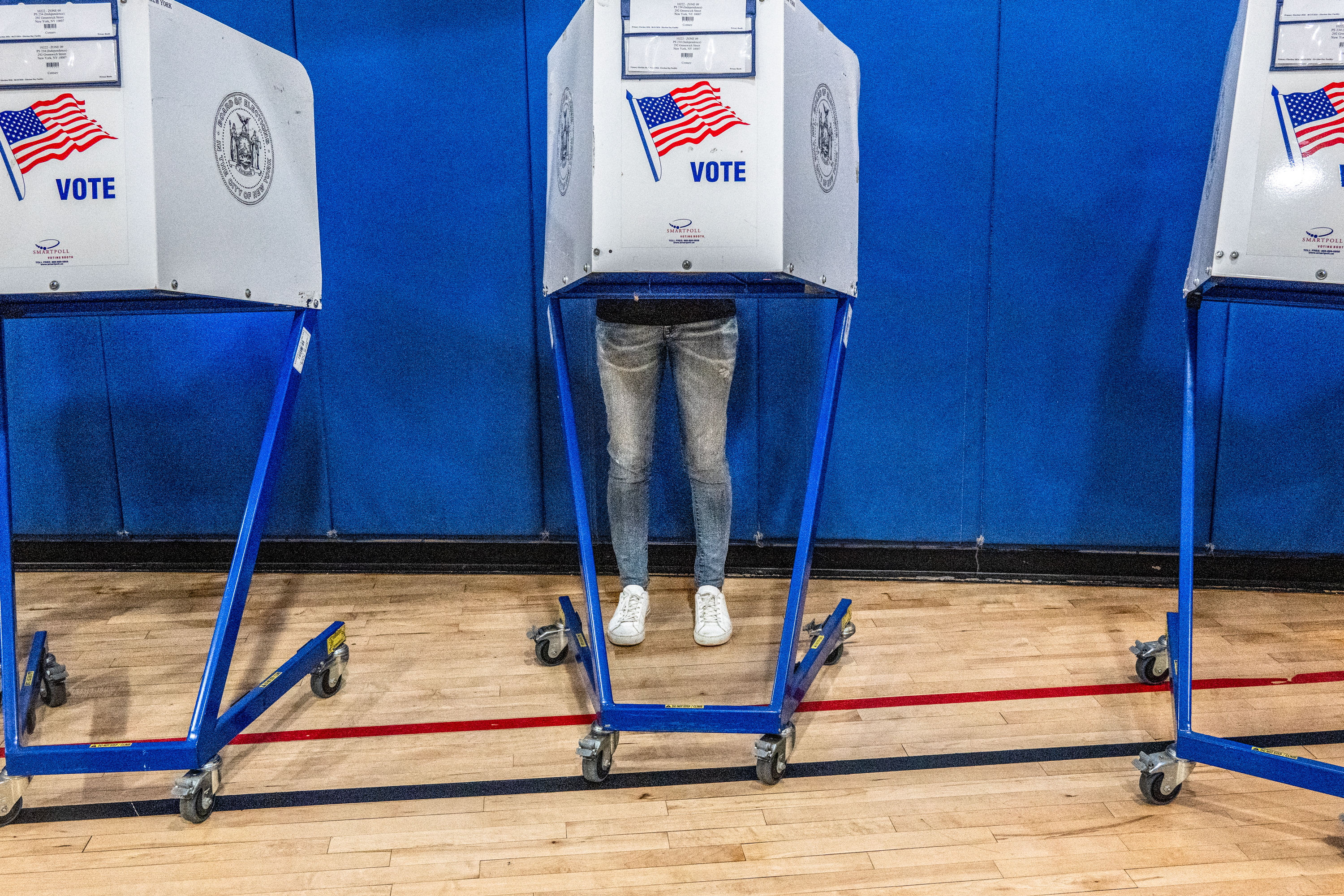 A voter casts their ballot at a polling station in Manhattan